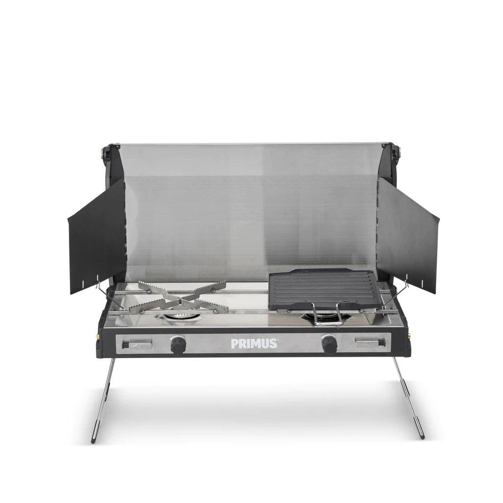 Primus Tupike camping stove with two burners and side windshields on white background