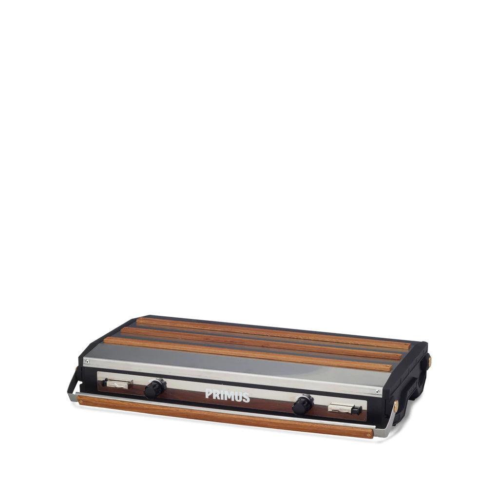 Primus Tupike camping stove with wood accents, closed, on white background