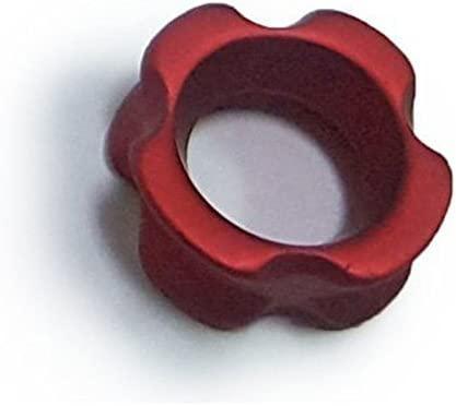 Red aluminum archery peep sight with grooved edges on white background