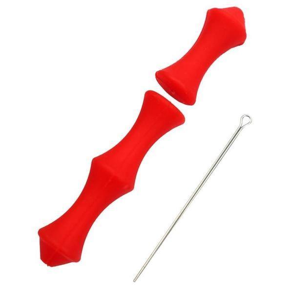 Red archery finger savers and metal threading tool on white background