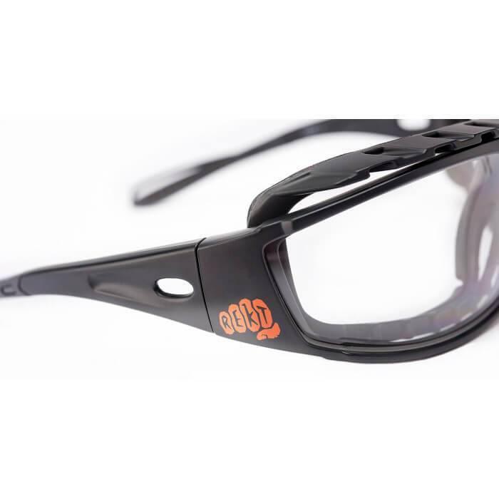 Black REKT eye pro safety goggles with clear lenses and orange logo on the frame