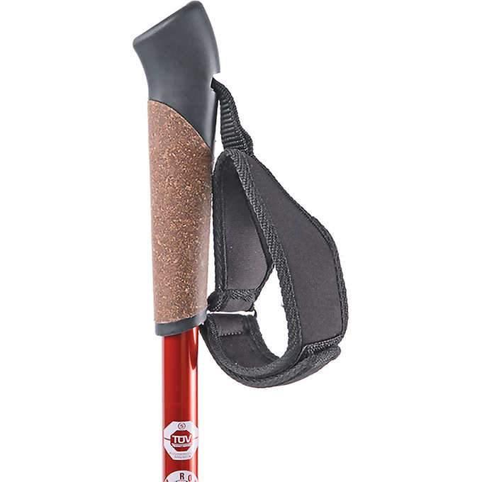 Red Nordic walking pole with cork handle grip and adjustable wrist strap