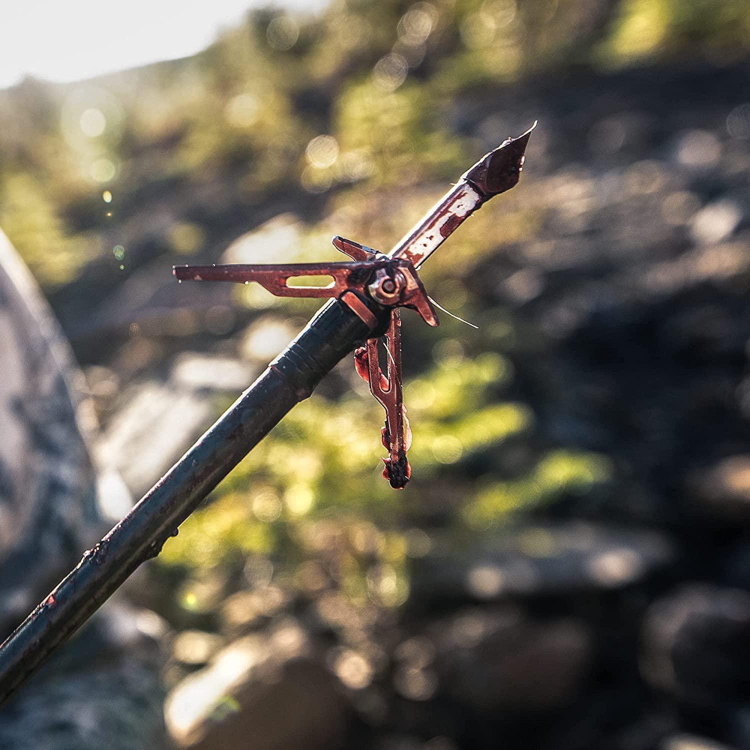 SIK SK2 broadhead arrow tip with blood outdoors, hunting archery equipment closeup