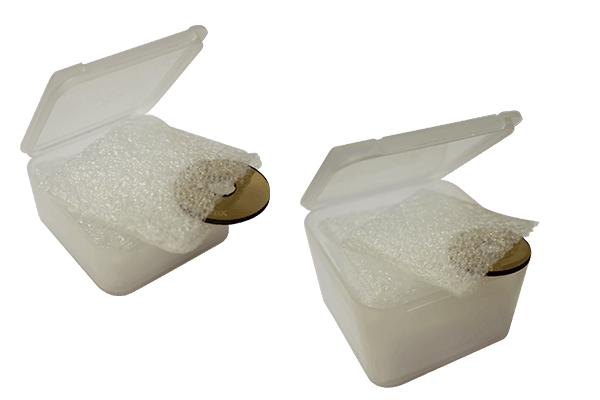 Two Specialty Archery Lens Caddy cases with foam pads and archery lens inside