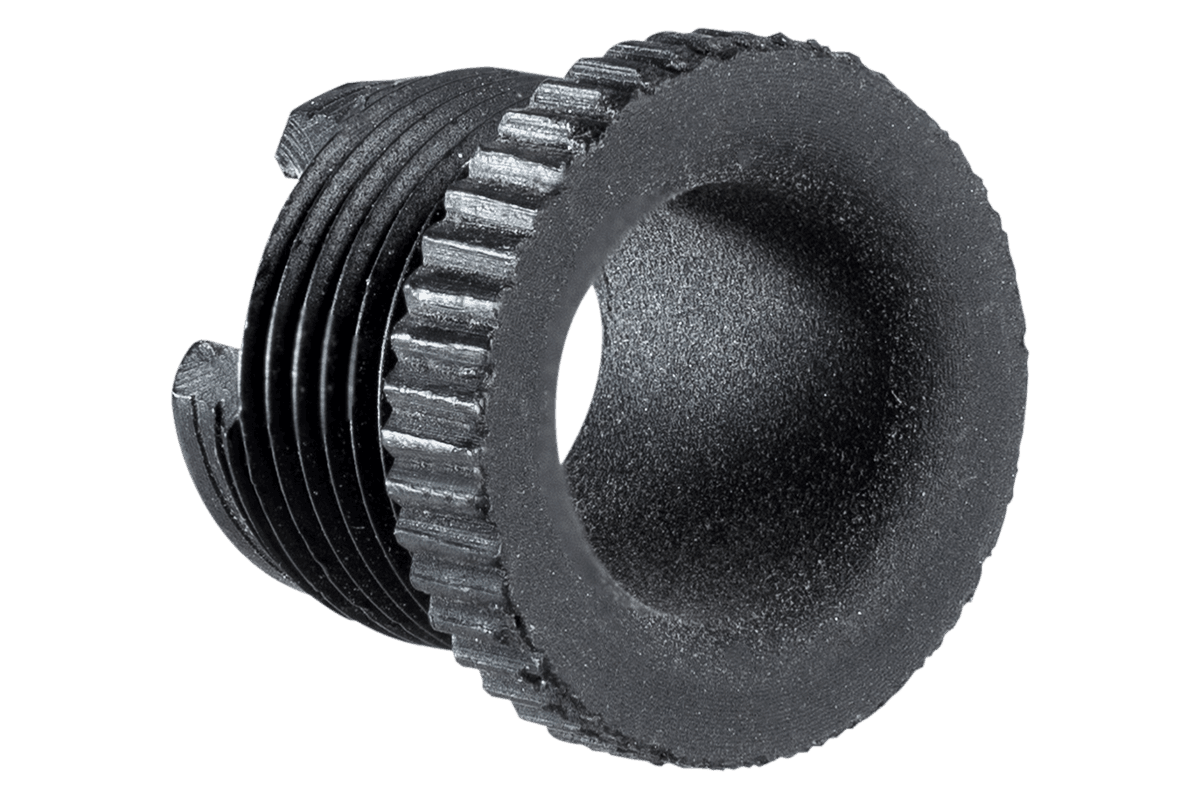 Black specialty archery PXL Hunter peep sight aperture with ribbed edges on gray background