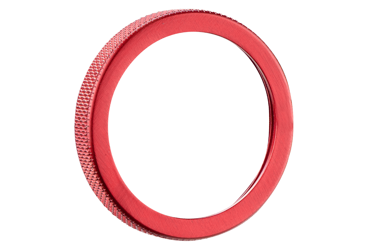 Red Specialty Archery Versa clamp ring with textured edge on a plain background