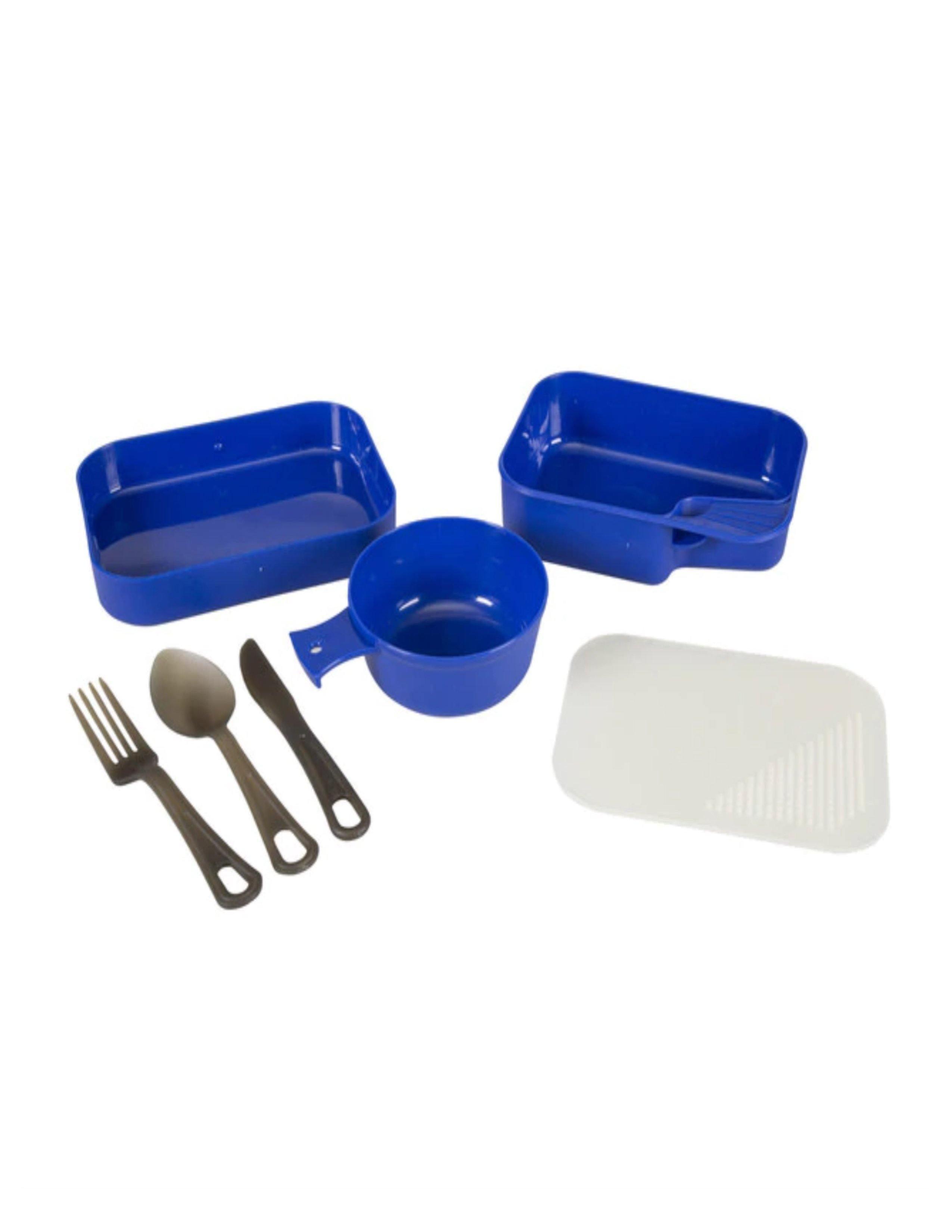 Stansport 1-person compact camping table set with blue dishes, black cutlery, and white cutting board