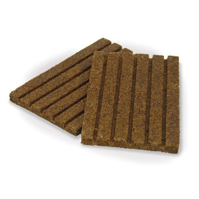 Two Stansport waterproof fire starter sticks on white background, wood fiber texture, camping gear