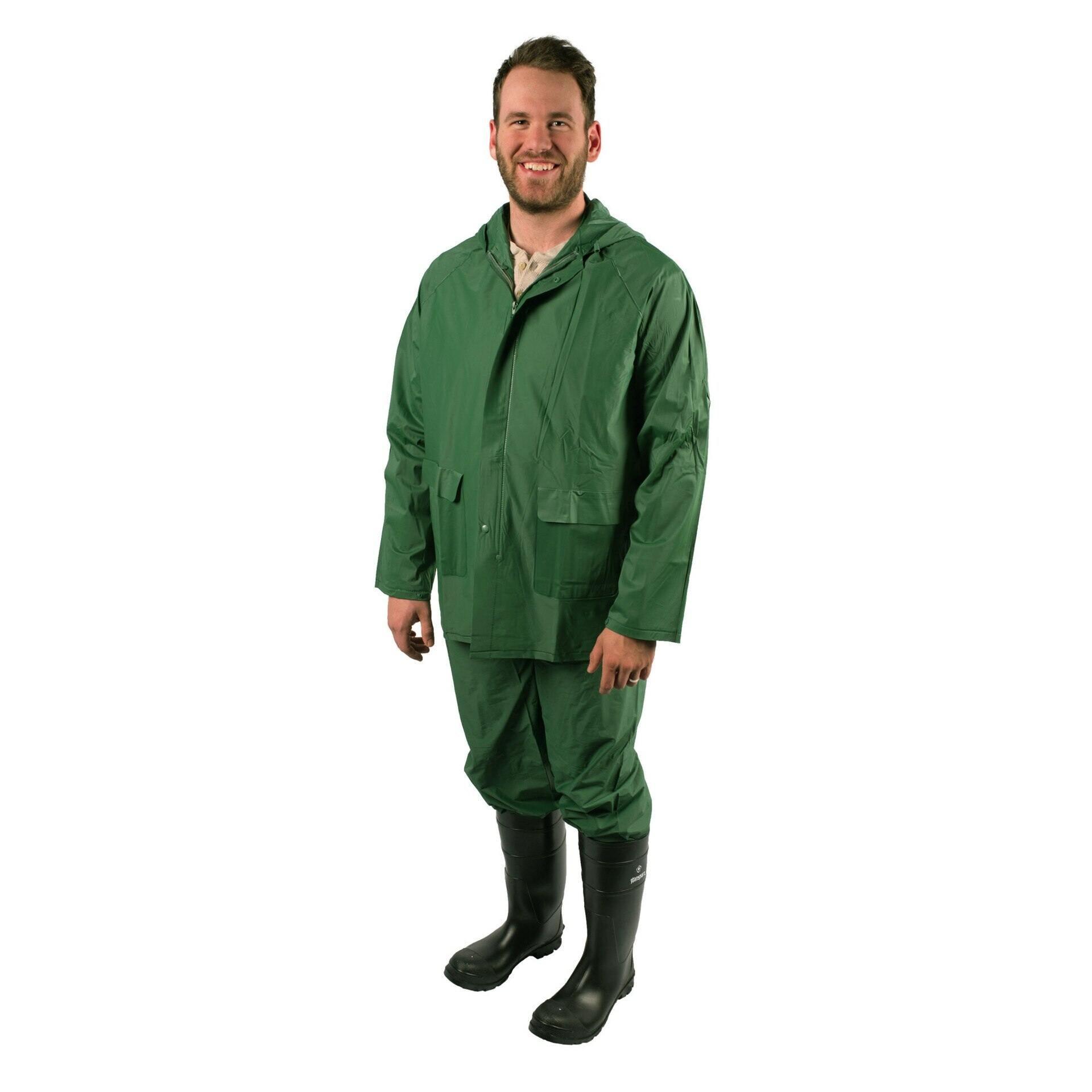 Man wearing green two-piece industrial rain suit with hood and black rain boots