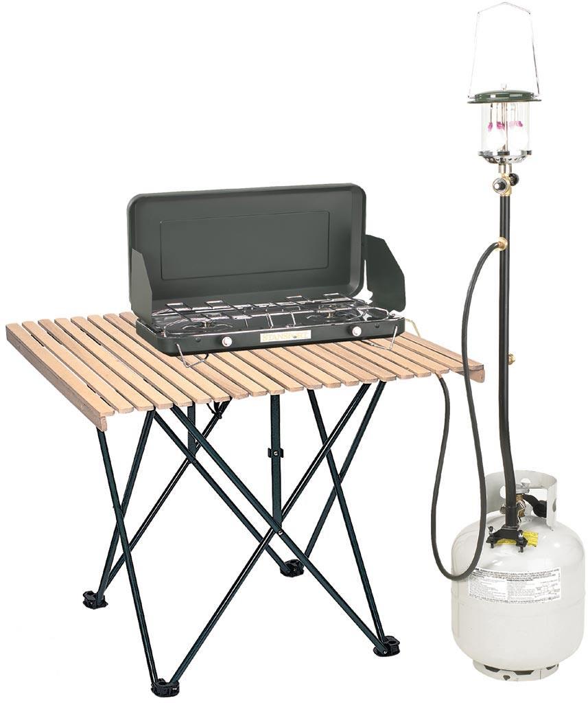 Camping stove and propane lantern connected to tank on folding wood slat table