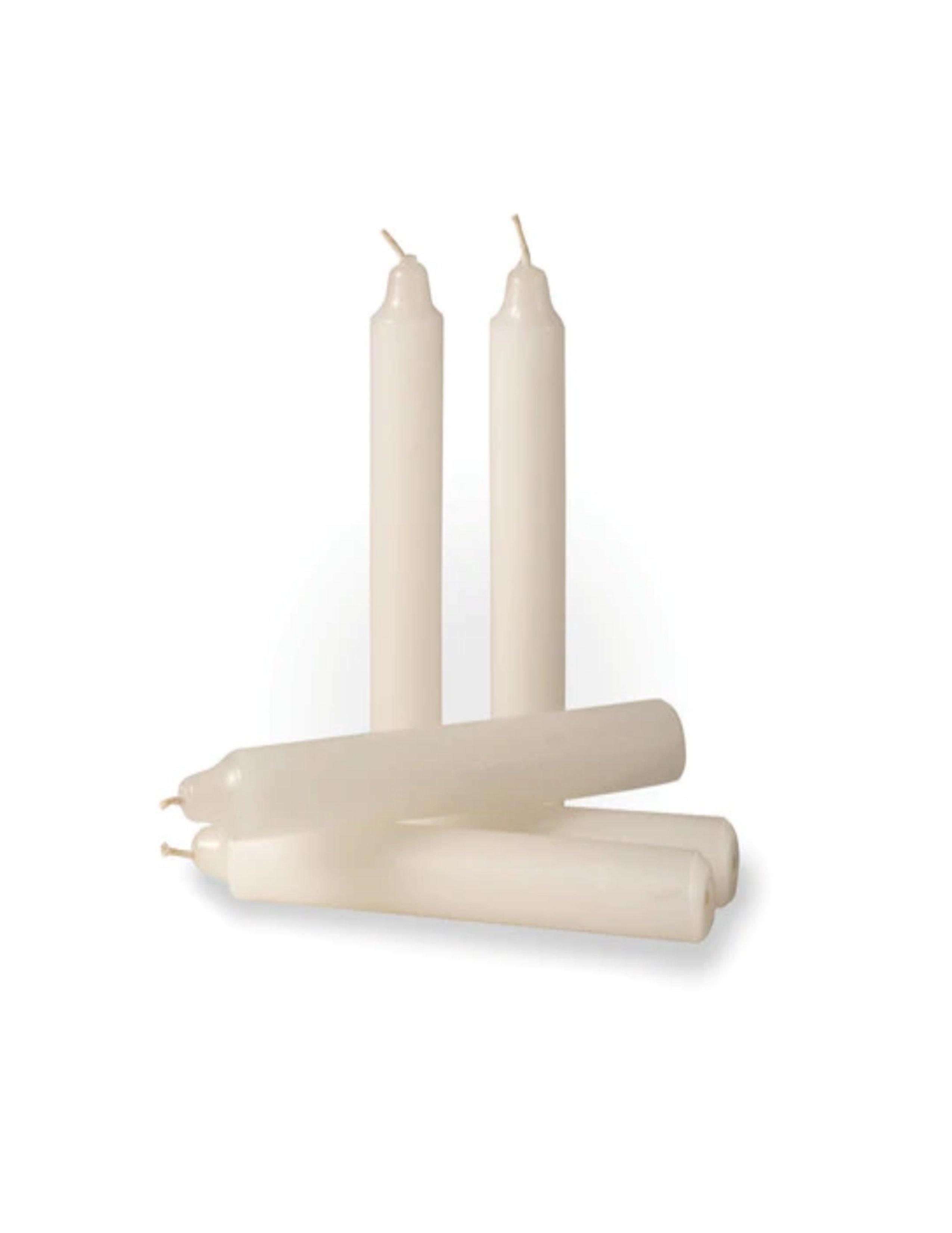 Five white Stansport camper candles arranged on a plain white background