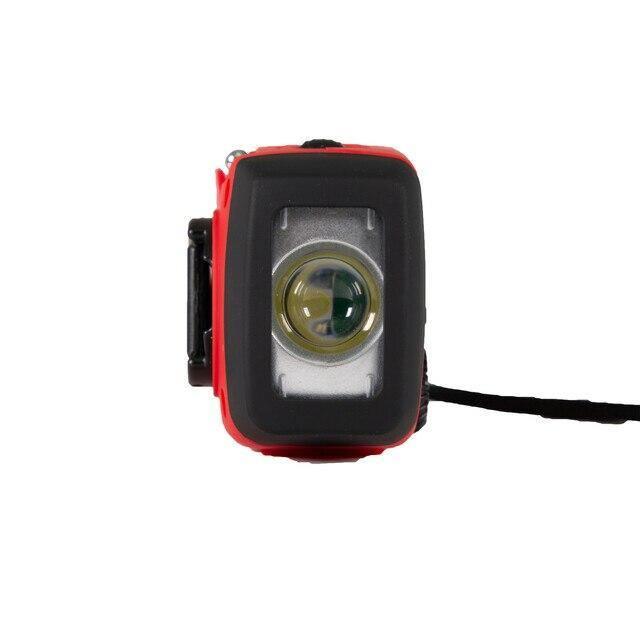 Front view of a red handheld solar dynamo flashlight with radio on white background