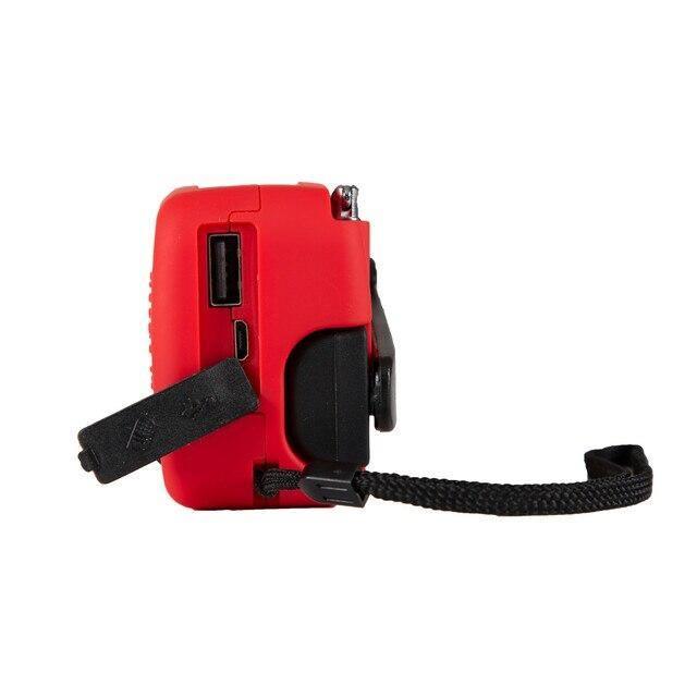 Red handheld solar dynamo flashlight radio with USB port and black wrist strap