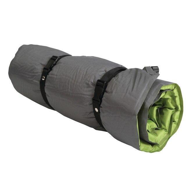 Rolled gray and green self-inflating camping air mat with black straps