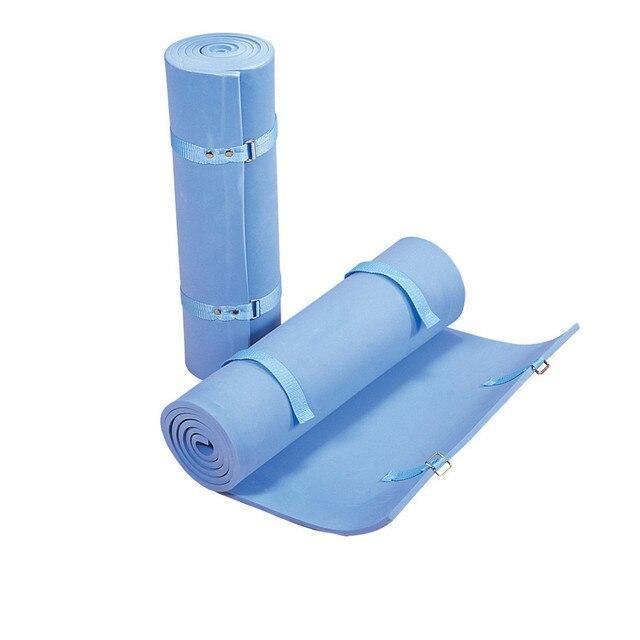 Blue foam camping and backpacking sleeping pads with straps on white background