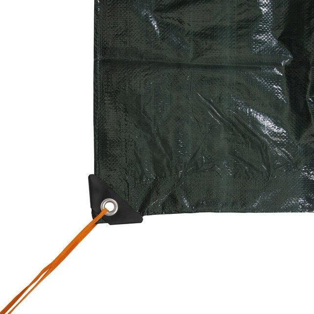 Green rip-stop tarp corner with reinforced grommet and orange tie-down rope