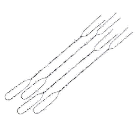 Set of four steel campfire toaster grill forks on white background
