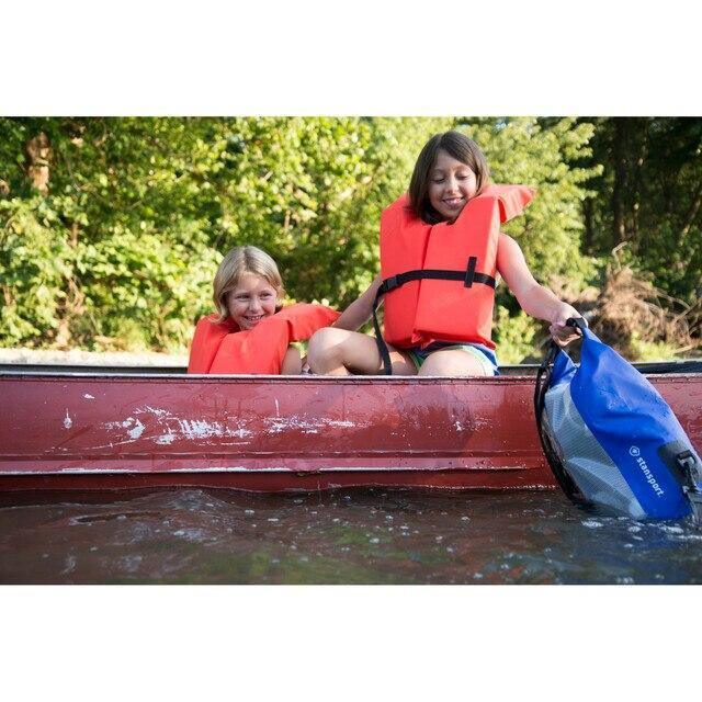 Two children in life jackets on a canoe holding a blue Stansport waterproof dry bag
