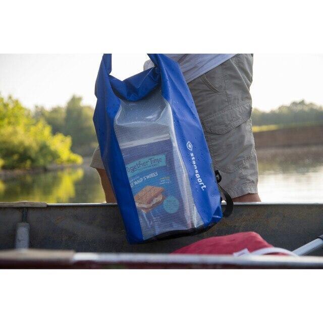 Blue Stansport waterproof dry bag in a boat, outdoor setting by the water.