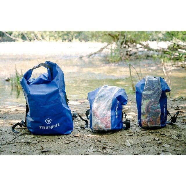 Stansport blue waterproof dry bags by riverside on outdoor ground