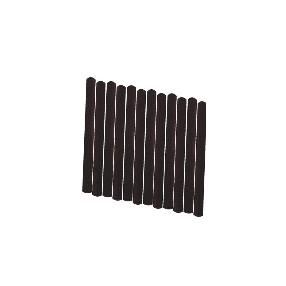 Twelve black solid fuel sticks for camping or outdoor cooking on a white background