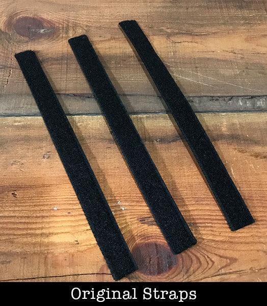 Three black velcro straps on wood table, Ultimate Predator decoy accessory