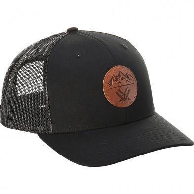 Black mesh trucker cap with brown leather patch featuring mountain design