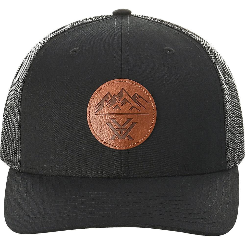 Black trucker hat with brown leather patch featuring mountain and logo design