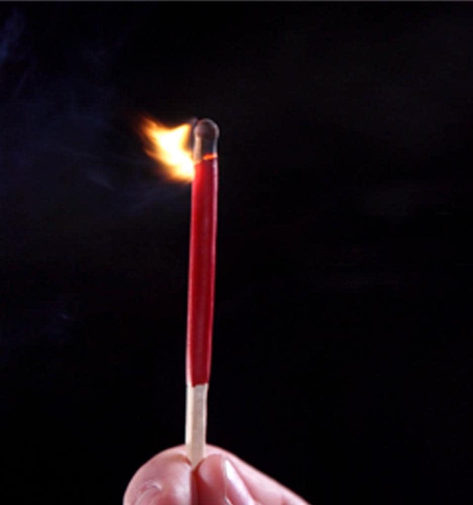 Hand holding a lit red Typhoon match against a dark background, fire visible.